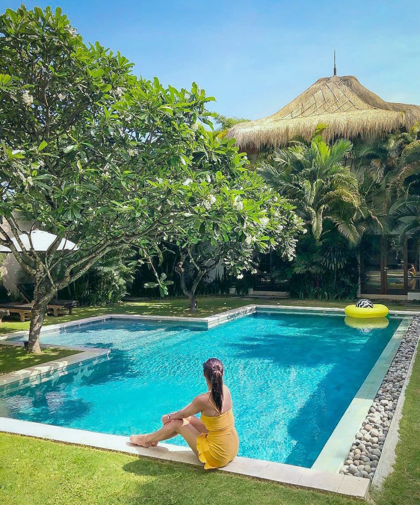 a-woman-in-yellow-dress-spend-an-afternoon-at-Villa-Chocolat-poolside